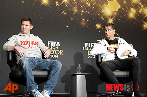 Lionel Messi, left, of Argentina and Cristiano Ronaldo of Portugal, two of the nominees for the FIFA Ballon d'Or 2014 award, attend a press conference prior to the FIFA Ballon d'Or awarding ceremony at the Kongresshaus in Zurich, Switzerland, Monday, Jan. 12, 2015. (AP Photo/Keystone, Walter Bieri)