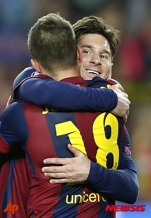 Barcelona's Lionel Messi, right, celebrates after winning 3-0 during the Champions League semifinal first leg soccer match between Barcelona and Bayern Munich at the Camp Nou stadium in Barcelona, Spain, Wednesday, May 6, 2015. (AP Photo/Manu Fernandez)
