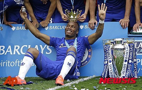 FILE - In this Sunday, May 24, 2015 file photo, the crown of the trophy is placed on the head of Didier Drogba after the English Premier League soccer match between Chelsea and Sunderland at Stamford Bridge stadium in London. Montreal Impact says it has signed former Chelsea striker Didier Drogba. Impact confirmed the signing on Monday, July 27, 2015 following a trade with Chicago Fire, which had initially completed a move for the 37-year-old forward. (AP Photo/Matt Dunham, File)