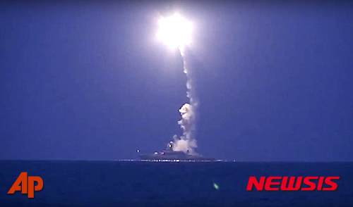 In this photo made from the footage taken from Russian Defense Ministry official web site, Wednesday, Oct. 7, 2015, a Russian navy ship launches a cruise missile in the Caspian Sea. Russia's Defense Minister Sergei Shoigu said four?Russian navy ships in the Caspian launched 26 cruise missiles at Islamic State targets in Syria.(Russian Defense Ministry Press Service via AP)
