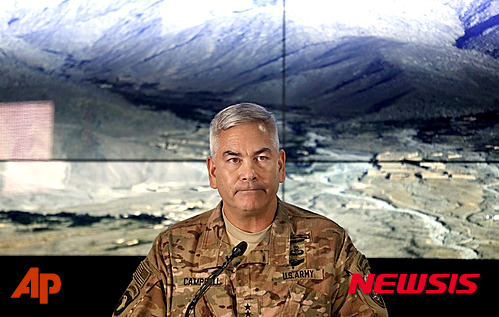 Commander of U.S. and NATO forces in Afghanistan, General John F. Campbell listens during a press conference at the Resolute Support Headquarters in Kabul, Afghanistan, Wednesday, Nov. 25, 2015. (AP Photos/Massoud Hossaini, Pool)