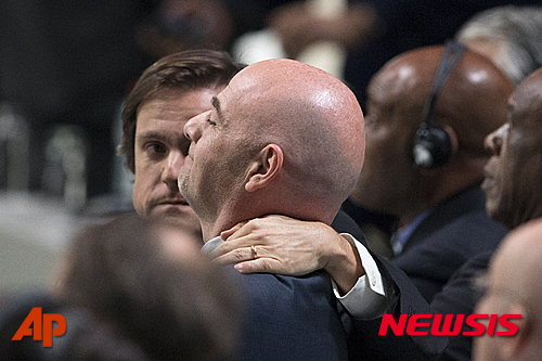 Gianni Infantino of Switzerland , new FIFA President, is congratulated after being elected during the Extraordinary FIFA Congress 2016 in Zurich, Switzerland, Friday, February 26, 2016. Gianni Infantino of Switzerland is the new FIFA president after winning a second-round vote. Infantino got 115 of the 207 eligible votes to take a decisive majority ahead of Sheikh Salman of Bahrain.  (Patrick B. Kraemer/Keystone via AP)