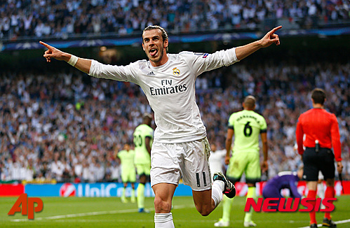 Real Madrid's Gareth Bale celebrates after scoring the opening goal during the Champions League semifinal second leg soccer match between Real Madrid and Manchester City at the Santiago Bernabeu stadium in Madrid, Wednesday May 4, 2016. (AP Photo/Francisco Seco)