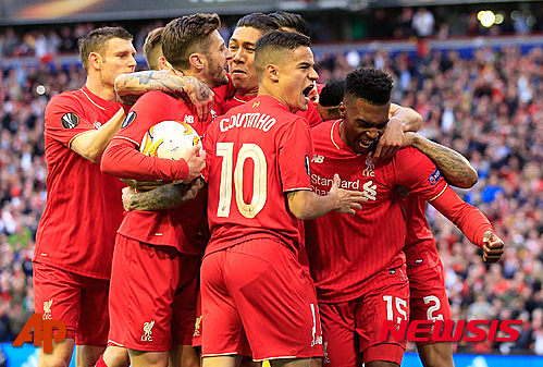 Liverpool players celebrate the opening goal during the Europa League semifinal, second leg, soccer match between Liverpool and Villarreal at Anfield Stadium, Liverpool, England, Thursday May 5, 2016. (AP Photo/Jon Super)