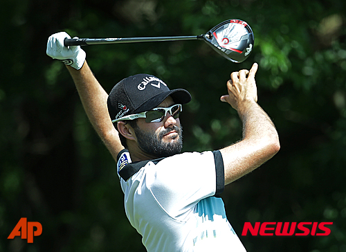 Adam Hadwin, of Canada, hits from the fifth tee during the second round of The Players Championship golf tournament Friday, May 13, 2016, in Ponte Vedra Beach, Fla. (AP Photo/Lynne Sladky)