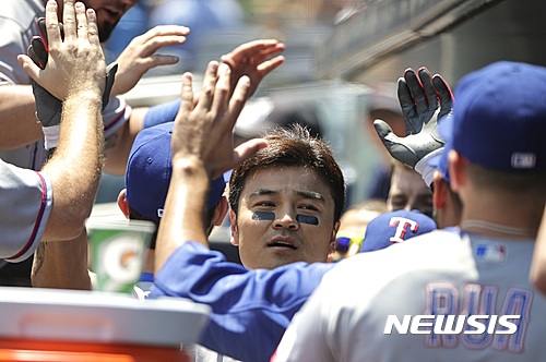 Texas Rangers' Shin-Soo Choo celebrates with teammates after hitting a home run during the first inning of a baseball game against the New York Yankees Thursday, June 30, 2016, in New York. (AP Photo/Frank Franklin II)