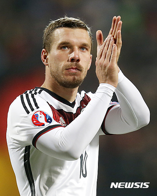 FILE - In this Nov. 14, 2014 file picture Germany's Lukas Podolski applauds after a Group D Euro 2016 qualifying match between Germany and Gibraltar in Nuremberg, Germany. Veteran forward Lukas Podolski has announced his retirement from Germany's national team. Podolski said in an Instagram post Monday Aug. 15, 2016 he had informed Germany coach Joachim Loew that he is retiring from international football with immediate effect. The 31-year-old Galatasaray player, who was born in Poland, has played 129 games for Germany over 12 years, scoring 48 goals and winning the World Cup two years ago. (AP Photo/Michael Probst,file)