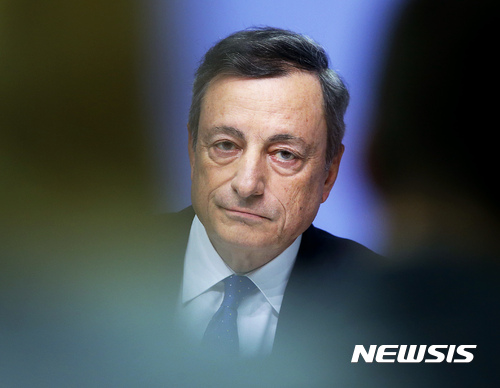 President of European Central Bank, Mario Draghi, listens during a news conference in Frankfurt, Germany, Thursday, Dec. 8, 2016, following a meeting of the ECB governing council. (AP Photo/Michael Probst)