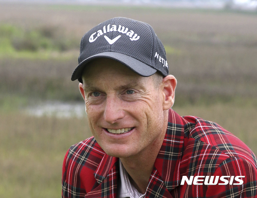 FILE - In this April 19, 2015, file photo, Jim Furyk poses after winning a playoff against Kevin Kisner during the RBC Heritage golf tournament in Hilton Head Island, S.C. Furyk has been appointed U.S. captain for the 2018 Ryder Cup in France. Furyk will be in charge of a team that will try to win on European soil for the first time since 1993 at The Belfry. (AP Photo/Stephen B. Morton, File)