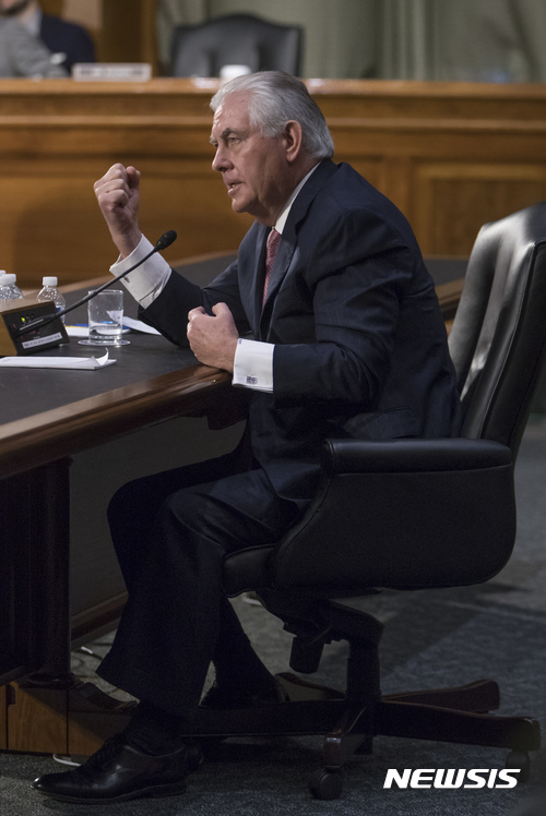 Secretary of State-designate Rex Tillerson gestures as he testifies on Capitol Hill in Washington, Wednesday, Jan. 11, 2017, at his confirmation hearing before the Senate Foreign Relations Committee. (AP Photo/J. Scott Applewhite)