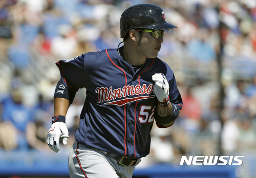 Minnesota Twins' Byung Ho Park heads for first base after hitting a two-run home run off Toronto Blue Jays starting pitcher Francisco Liriano during the fifth inning of a spring training baseball game Monday, March 20, 2017, in Dunedin, Fla. (AP Photo/Chris O'Meara)