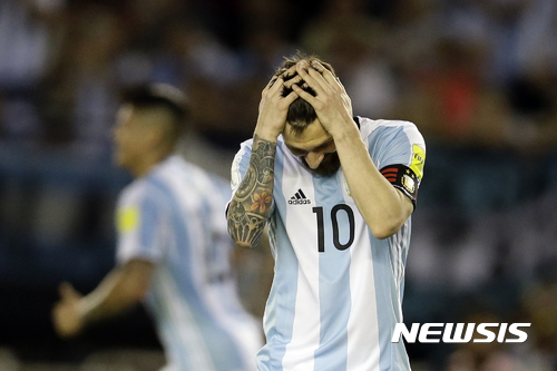 In this March 23, 2017 photo, Argentina's Lionel Messi reacts after missing a chance to score during a World Cup qualifying match against Chile in Buenos Aires, Argentina. Messi has been banned from Argentina's next four World Cup qualifiers, starting with the Tuesday, March 28, 2017 game in Bolivia, for "having directed insulting words at an assistant referee" during a home qualifier against Chile on March 23, 2017, FIFA said. (AP Photo/Victor R. Caivano)