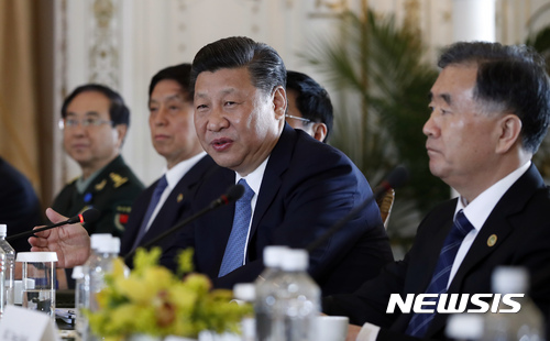 Chinese President Xi Jinping, joined by Chinese Vice Premier Wang Yang, right, speaks during a bilateral meeting with President Donald Trump at Mar-a-Lago, Friday, April 7, 2017, in Palm Beach, Fla. Trump was meeting again with his Chinese counterpart Friday, with U.S. missile strikes on Syria adding weight to his threat to act unilaterally against the nuclear weapons program of China's ally, North Korea. (AP Photo/Alex Brandon)
