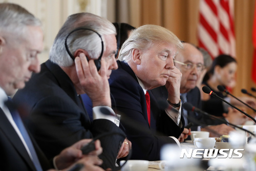 From left, Defense Secretary Jim Mattis, Secretary of State Rex Tillerson, President Donald Trump, Commerce Secretary Wilbur Ross, and others, listen as Chinese President Xi Jinping speaks during a bilateral meeting at Mar-a-Lago, Friday, April 7, 2017, in Palm Beach, Fla. Trump was meeting again with his Chinese counterpart Friday, with U.S. missile strikes on Syria adding weight to his threat to act unilaterally against the nuclear weapons program of China's ally, North Korea.(AP Photo/Alex Brandon)