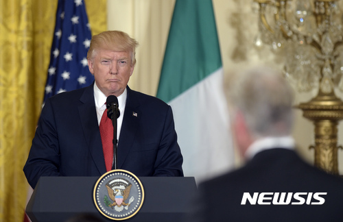 President Donald Trump, left, listens to question during a news conference with Italian Prime Minister Paolo Gentiloni in the East Room of the White House in Washington, Thursday, April 20, 2017. (AP Photo/Susan Walsh)