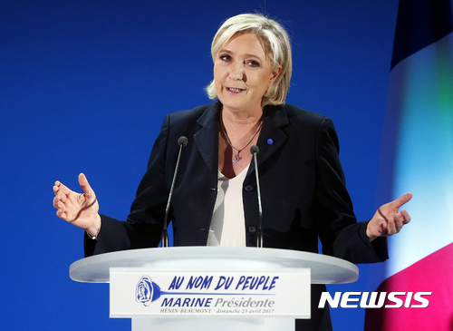 Far-right leader and candidate for the 2017 French presidential election, Marine Le Pen, addresses supporters after exit poll results of the first round of the presidential election were announced at her election day headquarters in Henin-Beaumont, northern France, Sunday, April 23, 2017. Polling agency projections show far-right leader Marine Le Pen and centrist Emmanuel Macron leading in the first-round French presidential election. (AP Photo/Michel Spingler)