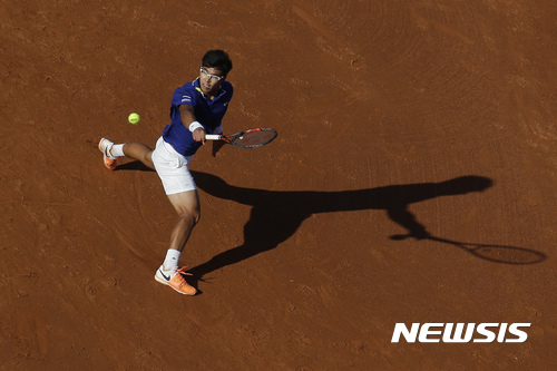 Hyeon Chung from South Korea returns the ball to Spain's Rafael Nadal during a quarterfinal match at the Barcelona Open Tennis Tournament in Barcelona, Spain, Friday, April 28, 2017. (AP Photo/Manu Fernandez)