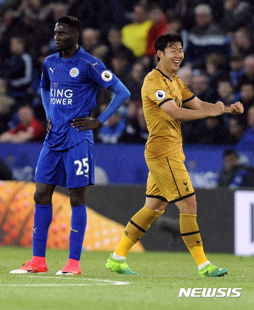 Tottenham's Son Heung-min, right, celebrates after scoring during the English Premier League soccer match between Leicester City and Tottenham Hotspur at the King Power Stadium in Leicester, England, Thursday, May 18, 2017. (AP Photo/Rui Vieira)