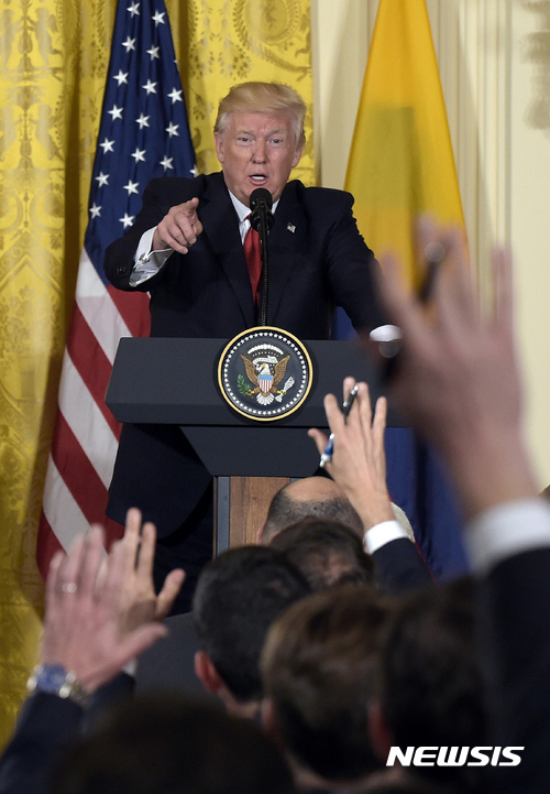 President Donald Trump calls on a reporter during a news conference with Colombian President Juan Manuel Santos in the East Room of the White House in Washington, Thursday, May 18, 2017. (AP Photo/Susan Walsh)