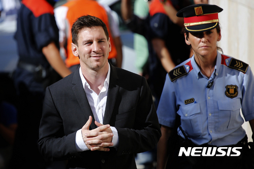 FILE - In this Sept. 27, 2013 file photo, FC Barcelona soccer player Lionel Messi, left, arrives at a court to answer questions in a tax fraud case in Gava, near Barcelona, Spain. Lionel Messi has lost his Supreme Court appeal over a tax-fraud conviction in Spain. The court has confirmed on Wednesday May 24, 2017, the 21-month prison sentence handed to Messi for defrauding tax authorities of 4.1 million euros from 2007-09. He is not expected to go to prison because sentences of less than two years for first offences are usually suspended in Spain. (AP Photo/Emilio Morenatti, File)