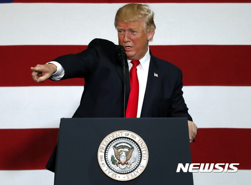 President Donald Trump gestures while speaking about tax reform, Wednesday, Aug. 30, 2017, at the Loren Cook Company in Springfield, Mo. (AP Photo/Jeff Roberson)