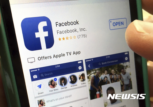 FILE - In this Monday, June 19, 2017, file photo, a user gets ready to launch Facebook on an iPhone, in North Andover, Mass. Facebook’s efforts to reduce the spread of fake news using outside fact-checkers may be working, but with a big caveat. The company says once a story receives a “false rating” from a fact-checker, Facebook is able to reduce future impressions of it by 80 percent. But it regularly takes more than three days for a story to receive a false rating. And, the way news stories work, most impressions happen when the story first comes out, not three days later. (AP Photo/Elise Amendola, File)