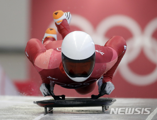 Jisoo Kim of South Korea starts his third run during the men&#039;s skeleton final at the 2018 Winter Olympics in Pyeongchang, South Korea, Friday, Feb. 16, 2018. (AP Photo/Wong Maye-E)