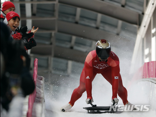Yun Sungbin of South Korea brakes in the finish area after his gold medal winning run during the men&#039;s skeleton final at the 2018 Winter Olympics in Pyeongchang, South Korea, Friday, Feb. 16, 2018. (AP Photo/Andy Wong)