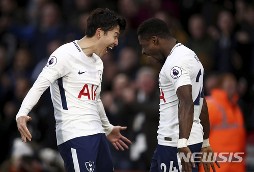 Tottenham Hotspur&#039;s Serge Aurier, right, celebrates scoring his side&#039;s fourth goal against AFC Bournemouth with teammate Son Heung-Min, during their English Premier League soccer match at the Vitality Stadium in Bournemouth, Sunday March 11, 2018. (John Walton/PA via AP)