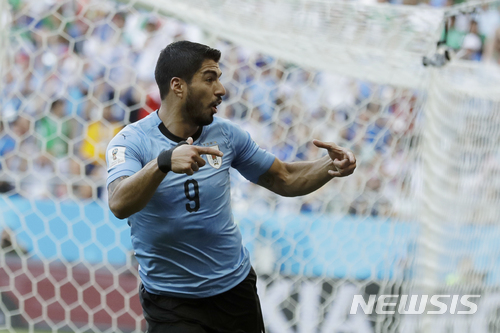 Uruguay&#039;s Luis Suarez celebrates scoring his side&#039;s first goal during the group A match against Saudi Arabia at the 2018 soccer World Cup in Rostov Arena in Rostov-on-Don, Russia, Wednesday, June 20, 2018. (AP Photo/Andrew Medichini)