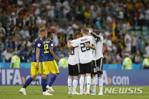 Germany players celebrate their team&#039;s 2-1 victory at the of the group F match between Germany and Sweden at the 2018 soccer World Cup in the Fisht Stadium in Sochi, Russia, Saturday, June 23, 2018. (AP Photo/Frank Augstein)