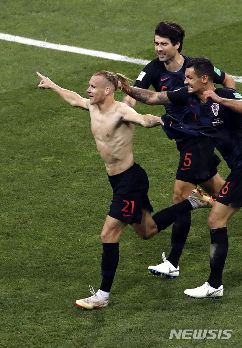 Croatia&#039;s Domagoj Vida, left, celebrates after scoring his side&#039;s second goal during the quarterfinal match between Russia and Croatia at the 2018 soccer World Cup at the Fisht Stadium in Sochi, Russia, Saturday, July 7, 2018. (AP Photo/Alexander Zemlianichenko)