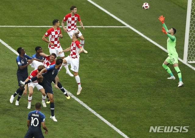 Croatia's Mario Mandzukic scores an own goal during the final match between France and Croatia at the 2018 soccer World Cup in the Luzhniki Stadium in Moscow, Russia, Sunday, July 15, 2018. (AP Photo/Frank Augstein) 