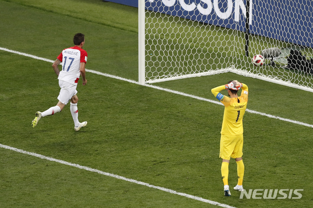 France goalkeeper Hugo Lloris reacts after Croatia's Mario Mandzukic scored his side' second goal during the final match between France and Croatia at the 2018 soccer World Cup in the Luzhniki Stadium in Moscow, Russia, Sunday, July 15, 2018. (AP Photo/Rebecca Blackwell) 