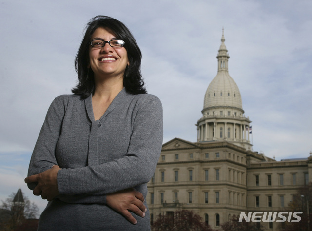 FILE - In this Nov. 6, 2008 file photo, Rashida Tlaib, a Democrat, is photographed outside the Michigan Capitol in Lansing, Mich. The Michigan primary victory of Tlaib, who is expected to become the first Muslim woman and Palestinian-American to serve in the U.S. Congress, is rippling across the Middle East. In the West Bank village where Tlaib’s mother was born, residents are greeting the news with a mixture of pride and hope that she will take on a U.S. administration widely seen as hostile to the Palestinian cause. (AP Photo/Al Goldis, File)