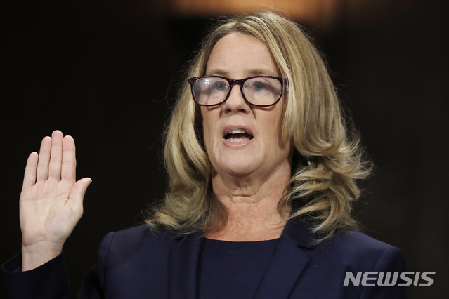 Christine Blasey Ford is sworn in to testify before the Senate Judiciary Committee on Capitol Hill in Washington, Thursday, Sept. 27, 2018. (Jim Bourg/Pool Photo via AP)