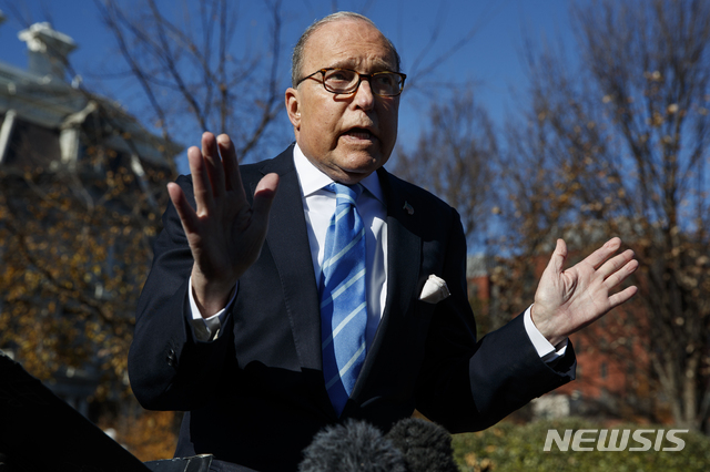 White House chief economic adviser Larry Kudlow talks with reporters about trade negotiations with China, at the White House, Monday, Dec. 3, 2018, in Washington. (AP Photo/Evan Vucci)
