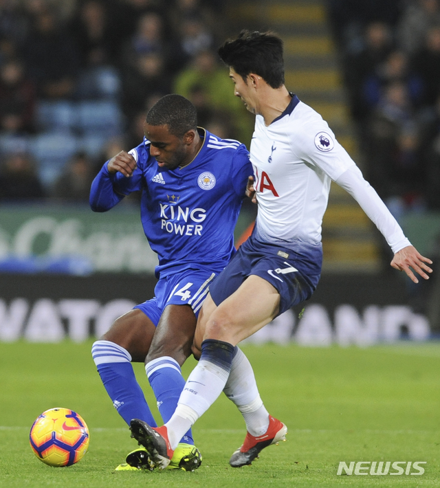 Leicester&#039;s Ricardo Pereira, left, challenge for the ball with Tottenham&#039;s Heung-Min Son during the English Premier League soccer match between Leicester City and Tottenham Hotspur at the King Power Stadium in Leicester, England, Saturday, Dec. 8, 2018. (AP Photo/Rui Vieira)