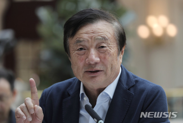 Ren Zhengfei, founder and CEO of Huawei, gestures during a round table meeting with the media in Shenzhen city, south China&#039;s Guangdong province, Tuesday, Jan. 15, 2019. The founder of network gear and smart phone supplier Huawei Technologies said the tech giant would reject requests from the Chinese government to disclose confidential information about its customers. (AP Photo/Vincent Yu)