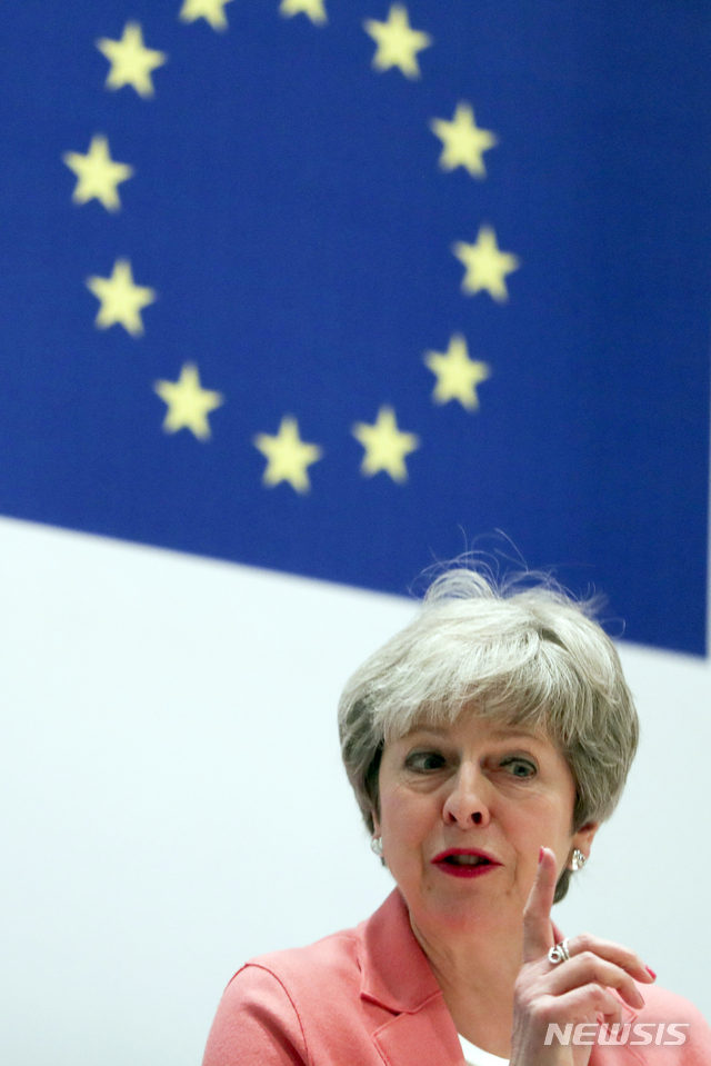 British Prime Minister Theresa May speaks during a media conference at the conclusion of an EU-Arab League summit at the Sharm El Sheikh convention center in Sharm El Sheikh, Egypt, Monday, Feb. 25, 2019. British Prime Minister Theresa May stays convinced that March 29 remains a realistic Brexit date, despite the EU urging Britain to delay its departure from the bloc to avoid a chaotic rupture. (AP Photo/Francisco Seco)