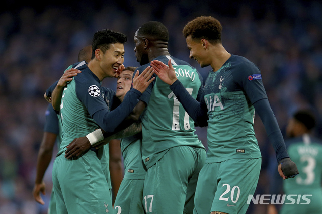 Tottenham&#039;s Son Heung-Min, left, celebrates scoring with Tottenham&#039;s Dele Alli, right, during the Champions League quarterfinal, second leg, soccer match between Manchester City and Tottenham Hotspur at the Etihad Stadium in Manchester, England, Wednesday, April 17, 2019. (AP Photo/Dave Thompson)
