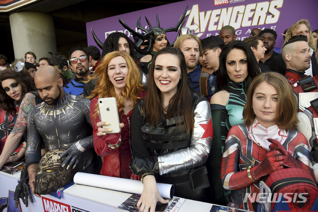 Fans dressed as Marvel characters are seen during the premiere of &quot;Avengers: Endgame&quot; at the Los Angeles Convention Center on Monday, April 22, 2019. (Photo by Chris Pizzello/Invision/AP)