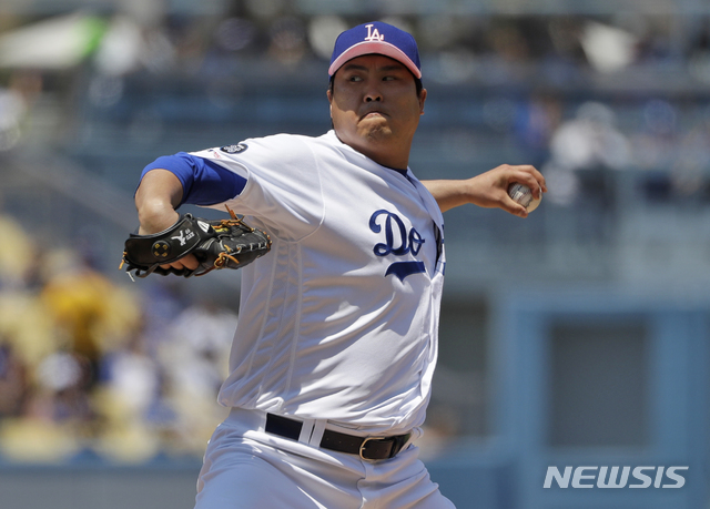 Los Angeles Dodgers starting pitcher Hyun-Jin Ryu throws to the Washington Nationals during the first inning of a baseball game Sunday, May 12, 2019, in Los Angeles. (AP Photo/Marcio Jose Sanchez)