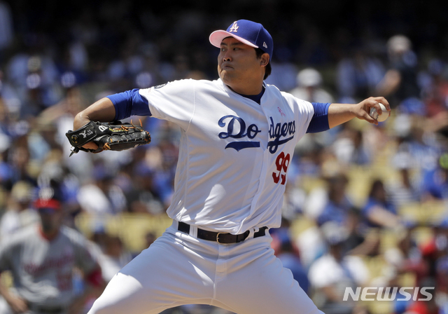 Los Angeles Dodgers starting pitcher Hyun-Jin Ryu throws to the Washington Nationals during the third inning of a baseball game Sunday, May 12, 2019, in Los Angeles. (AP Photo/Marcio Jose Sanchez)