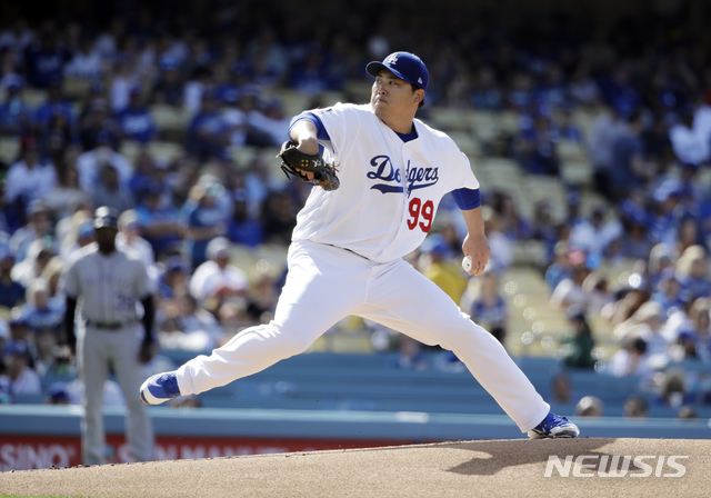 Los Angeles Dodgers starting pitcher Hyun-Jin Ryu throws to a Colorado Rockies batter during the first inning of a baseball game Saturday, June 22, 2019, in Los Angeles. (AP Photo/Marcio Jose Sanchez)