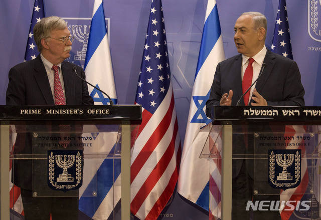 Israeli Prime Minister Benjamin Netanyahu, right, U.S. National Security Advisor John Bolton give statements to media in Jerusalem, Sunday, June 23, 2019. (AP Photo/Tsafrir Abayov, Pool)