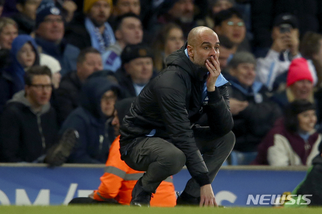 Manchester City&#039;s head coach Pep Guardiola reacts after a missed chance to score during the English League Cup semifinal second leg soccer match between Manchester City and Manchester United at Etihad stadium in Manchester, England, Wednesday, Jan. 29, 2020. (AP Photo/Dave Thompson)