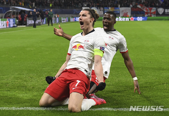Leipzig&#039;s Marcel Sabitzer, center, celebrates after scoring a goal during the Champions League round of 16, 2nd leg soccer match between RB Leipzig and Tottenham Hotspur in Leipzig, Germany, Tuesday, March 10, 2020. (Hendrik Schmidt/dpa via AP)