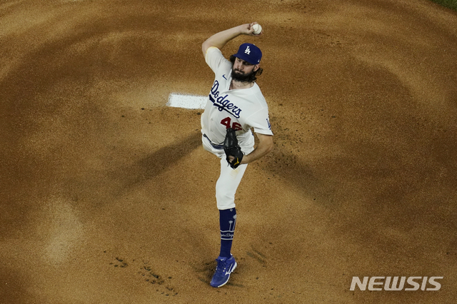 Los Angeles Dodgers starting pitcher Tony Gonsolin throws against the Tampa Bay Rays during the first inning in Game 2 of the baseball World Series Wednesday, Oct. 21, 2020, in Arlington, Texas. (AP Photo/David J. Phillip)