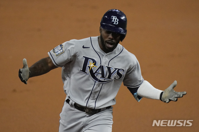 Tampa Bay Rays&#039; Randy Arozarena celebrates a home run during the first inning in Game 6 of the baseball World Series against the Los Angeles Dodgers Tuesday, Oct. 27, 2020, in Arlington, Texas. (AP Photo/Tony Gutierrez)